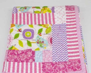 A-Little-Bird-Told-Me-patchwork-quilt-folded-Q000110