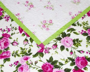 Cerise-patchwork-cot-quilt-centre-corner-detail-Q000112