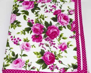 Cerise-patchwork-cot-quilt-folded-Q000112