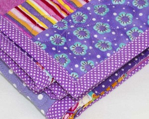 Cool-for-Purple-Cats-patchwork-cot-quilt-mitre-edge-detail-Q000114