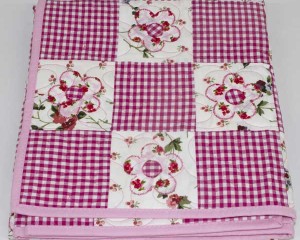 Daisy-May-patchwork-cot-quilt-folded-Q000111