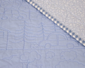 Happy-Days-Blue-cot-quilt-showing-reverse
