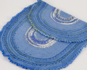 Oval-Blue-Variegated-crochet-blanket-with-frilly-edge-folded-back-CB106