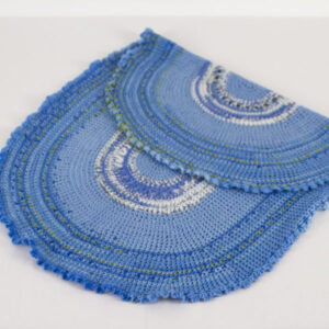 Oval-Blue-Variegated-crochet-blanket-with-frilly-edge-folded-back-CB106