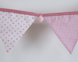 Baby pink bunting with pink pom-poms