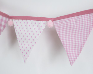 Baby pink bunting with pink pom-poms