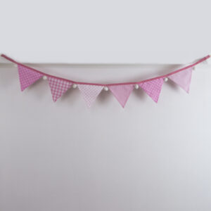 Baby pink bunting with white pom-poms front-on