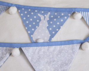 Bunny bunting in blue with white pom-poms showing reverse