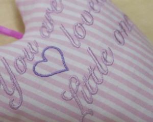 You are loved little one heart in pink close-up