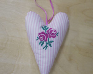 Deep pink cross-stitched rose heart