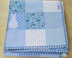 'It's Raining Rabbits' Quilt folded