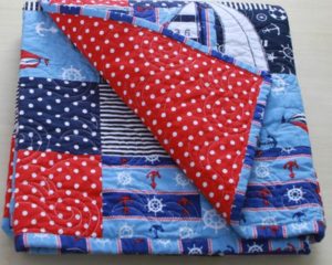 Gone-Sailing quilt-navy theme- flip back