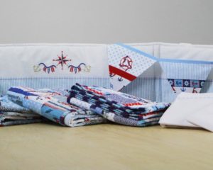 Windjammer cot bumper with nautical bunting, quilts and Little Boats sheet set