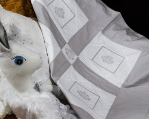 Emblem White and Silver-grey patchwork blanket