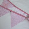 Applique embroidered butterfly bunting in pink showing reverse