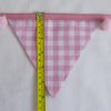 Baby pink bunting with pink pom-poms flag length