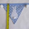 Bunny bunting in blue with white pom-poms flag length