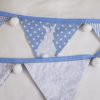 Bunny bunting in blue with white pom-poms showing reverse