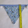 Rabbits and owls blue bunting with white pom-poms flag length