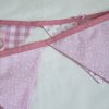 Ribbons and sequins bunting in pink showing reverse